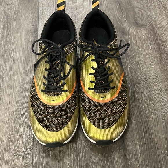 Gold and Black Nike Sneakers